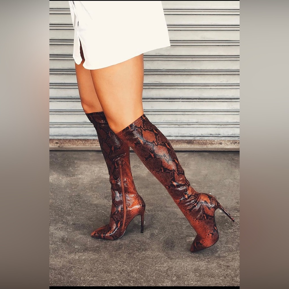 Snakeskin knee high boots